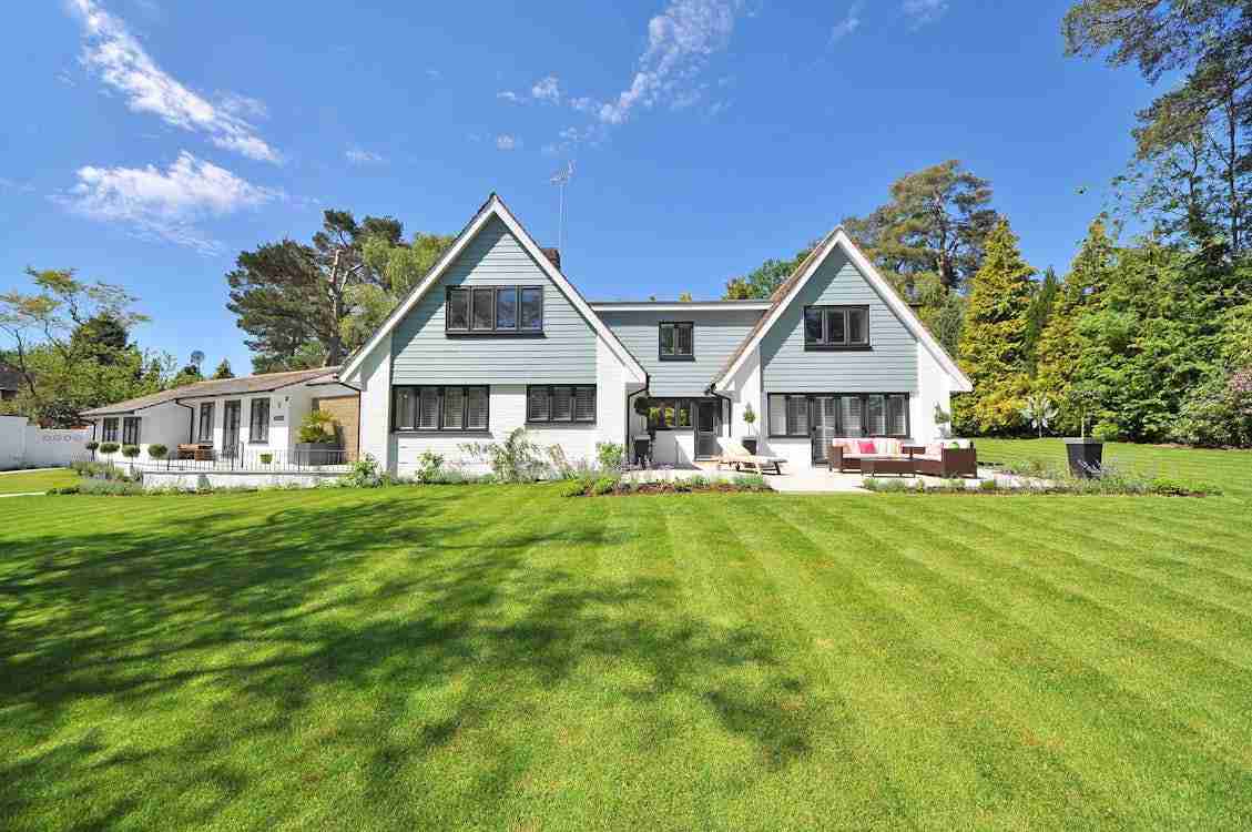 image of lawn and a sustainable home for blog Why You Should Consider Vacuum Insulation Panels When Building A Sustainable Home?